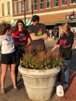 EAST Students Plant Flowers Downtown