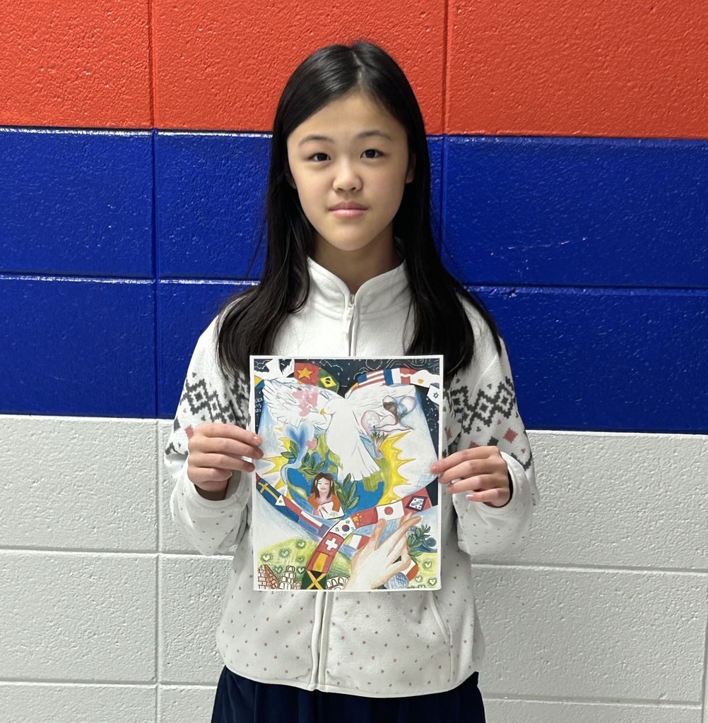 Ada Chen holding her award winning artwork